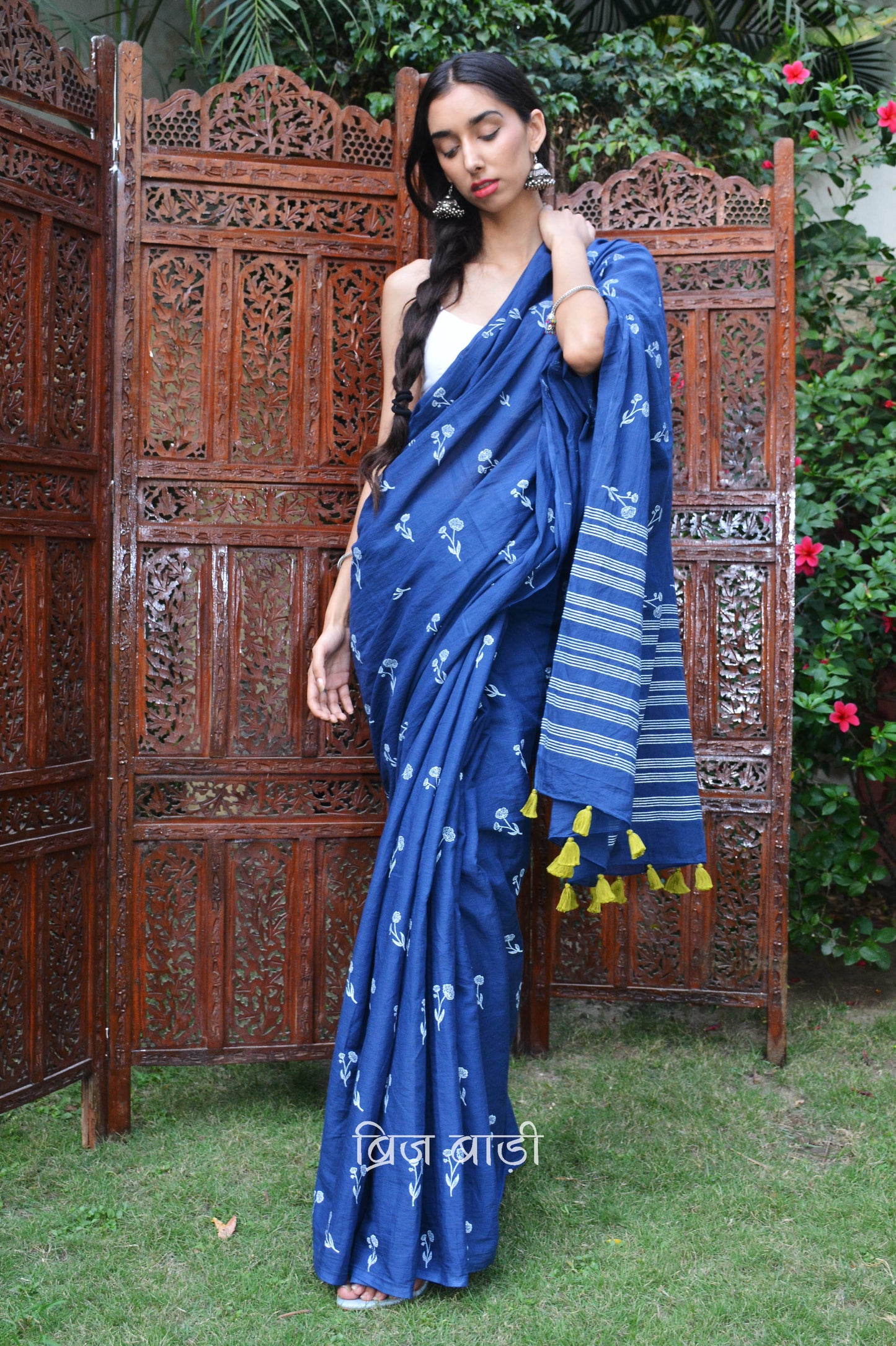 Blue hand block printed cotton saree with intricate floral motifs, lightweight and breathable fabric, includes a free matching blouse piece – perfect for everyday and festive wear.