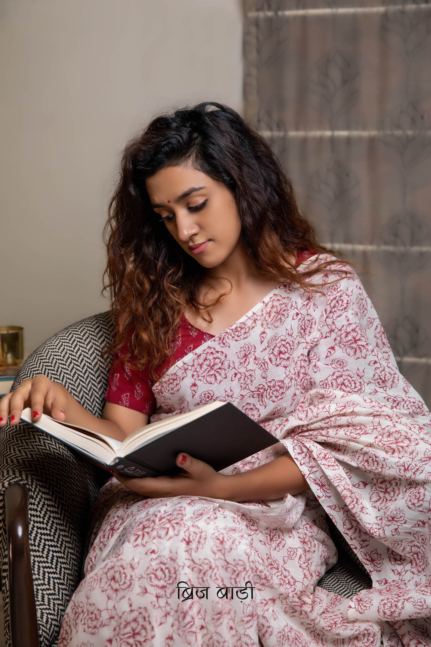 Off-white soft and light-weight cotton saree by Brij Bari, hand block printed with a delicate rose pattern for an elegant, understated everyday look. Crafted from breathable cotton, this saree ensures comfort and ease of wear, ideal for workdays, casual gatherings or daily summer dressing. The pallu is finished with bright olive green handmade thread tassels adding a traditional handcrafted detail to the look. Comes with a free hand block printed blouse piece designed to perfectly compliment the saree.