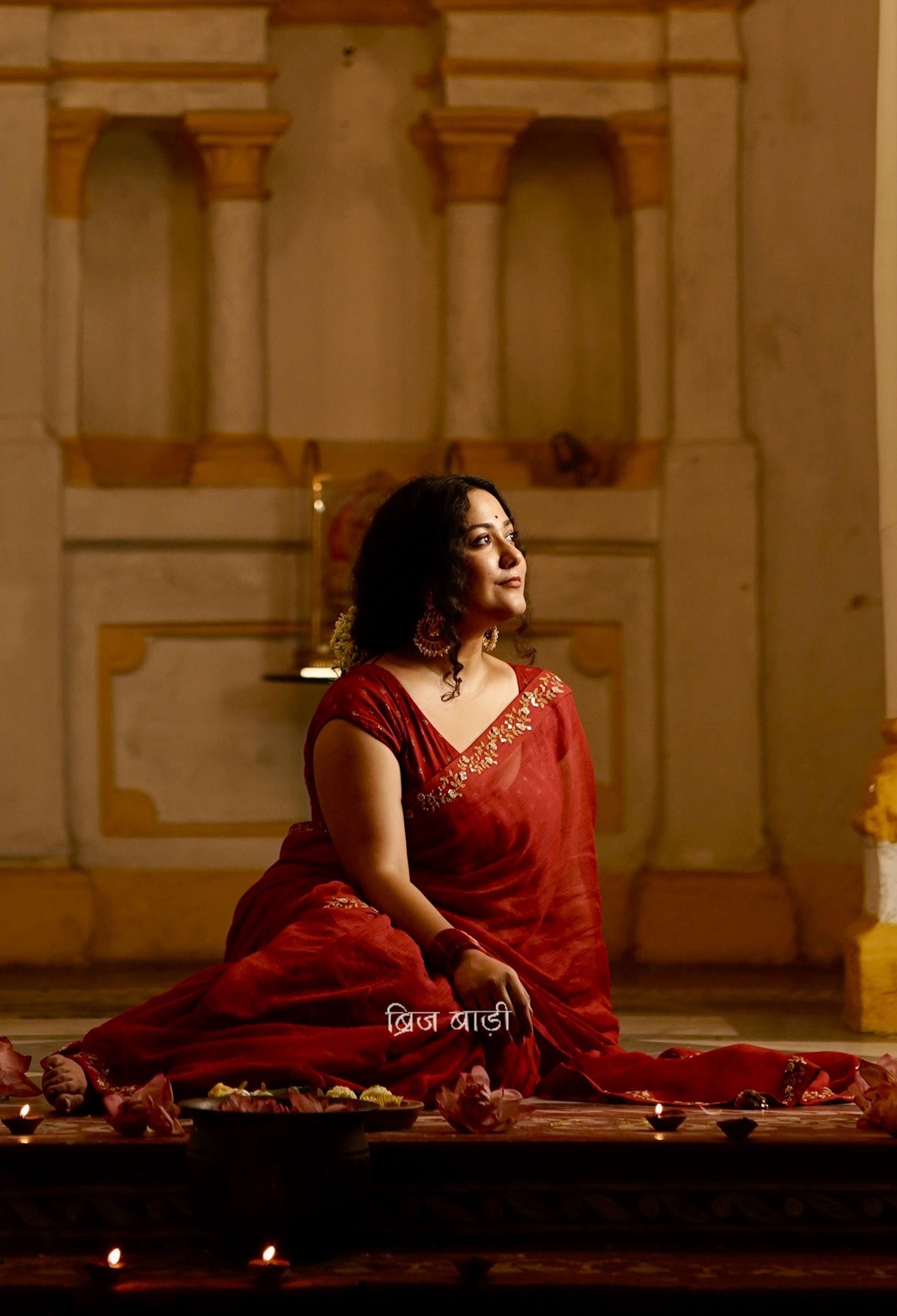 Jamuna handwoven deep-red colour Kota Doria saree with embroidered border and handmade thread tassel with ghungroo detailing on palla