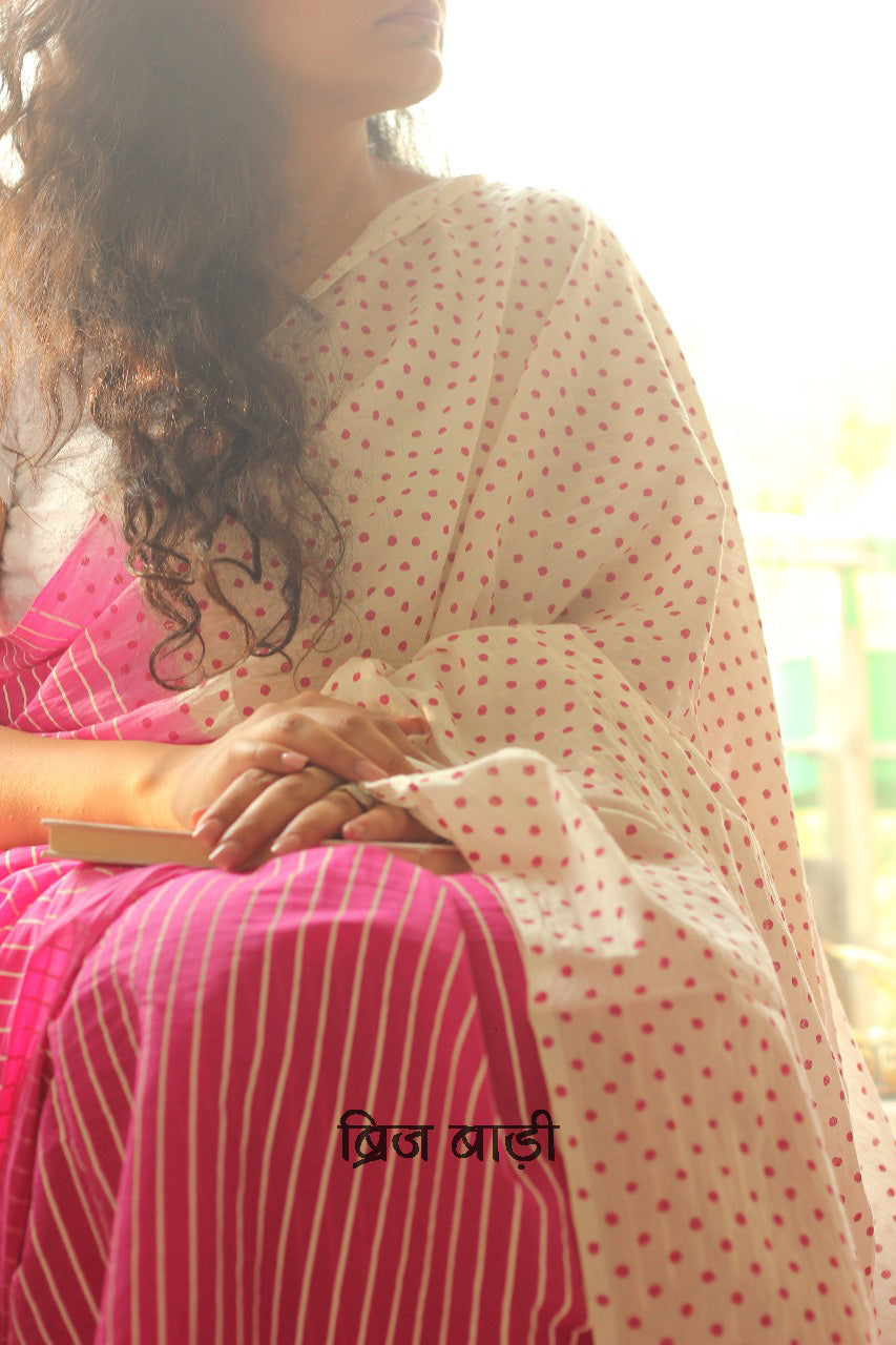 Pink Ombre cotton saree with bold hand block printed stripes and polka dots, artisan-crafted in breathable fabric. Includes matching printed blouse piece.