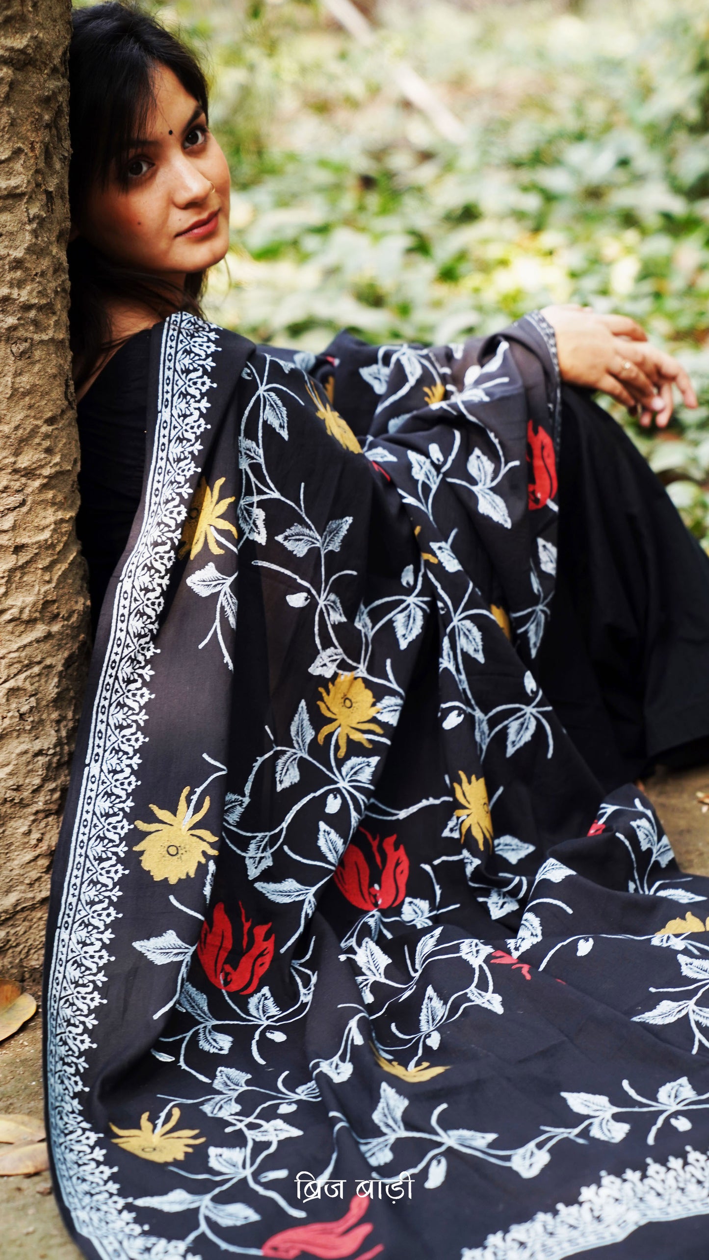 Black buttery soft and lightweight cotton dupatta by Brij Bari, hand block printed with a bold floral motif for a striking yet artisanal touch. Finished with handcrafted mustard thread tassels on both ends of the pallu, this dupatta is designed to complement a variety of suits. A versatile and breathable choice, perfect for effortless everyday elegance. Free shipping pan India.