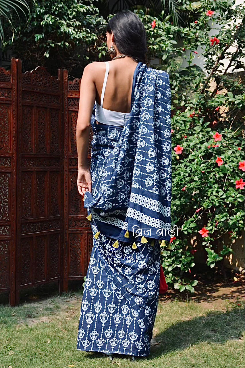Blue hand block printed cotton saree with intricate motifs, lightweight and breathable fabric, includes a free matching blouse piece – perfect for everyday and festive wear.