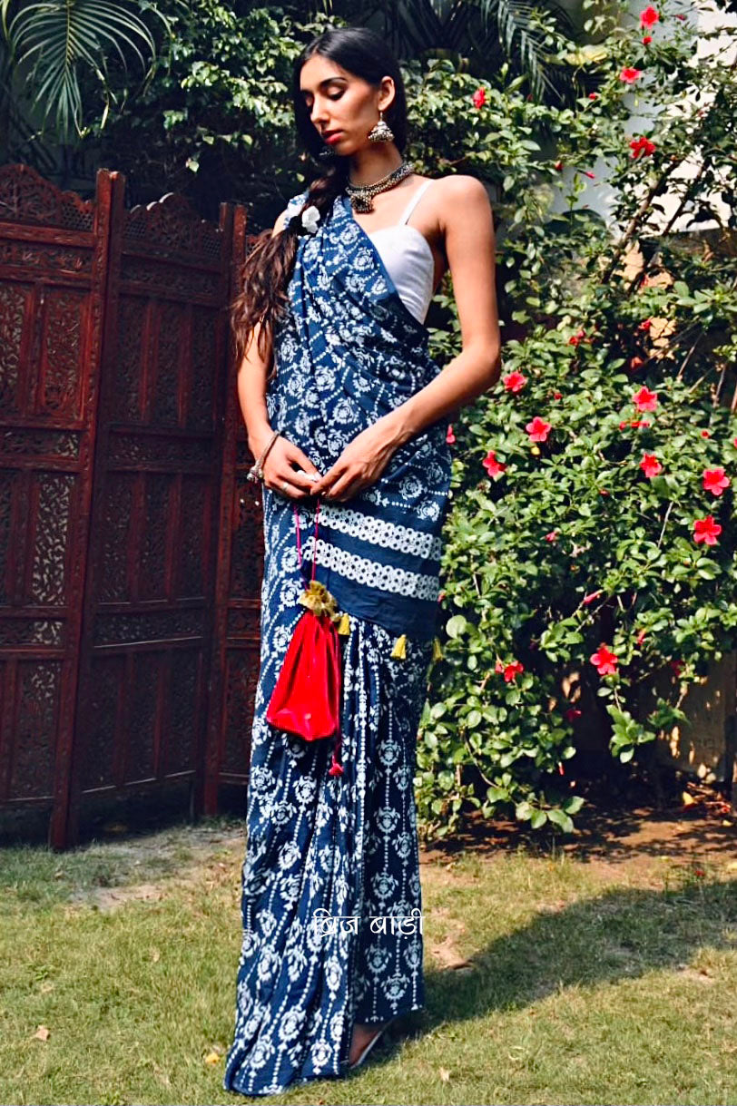 Blue hand block printed cotton saree with intricate motifs, lightweight and breathable fabric, includes a free matching blouse piece – perfect for everyday and festive wear.