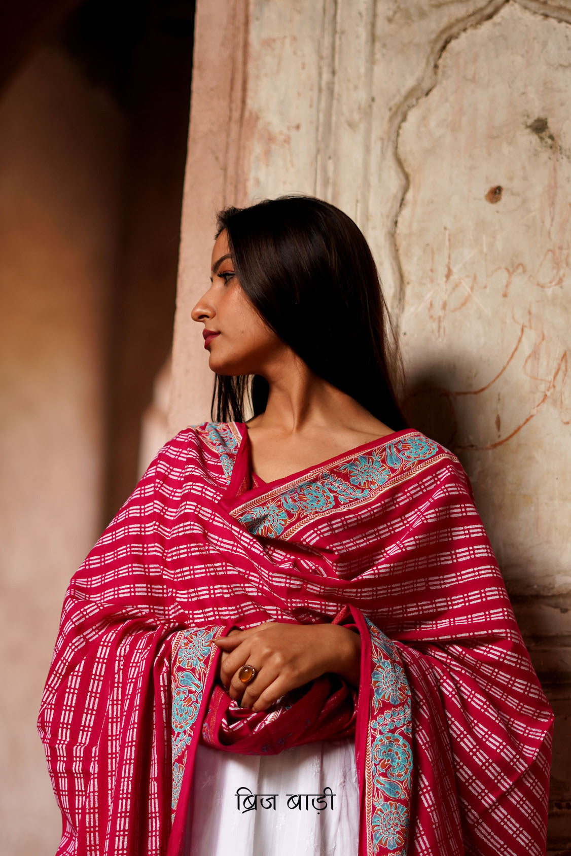 Pink soft and lightweight cotton dupatta by Brij Bari, hand block printed with a striking geometric pattern that adds a touch of artisanal detail. Finished with light blue handmade thread tassels on both ends of the pallu, this dupatta is a vibrant addition to your daily wear—offering a pop of colour, breathable comfort, and effortless style. Free shipping pan India.