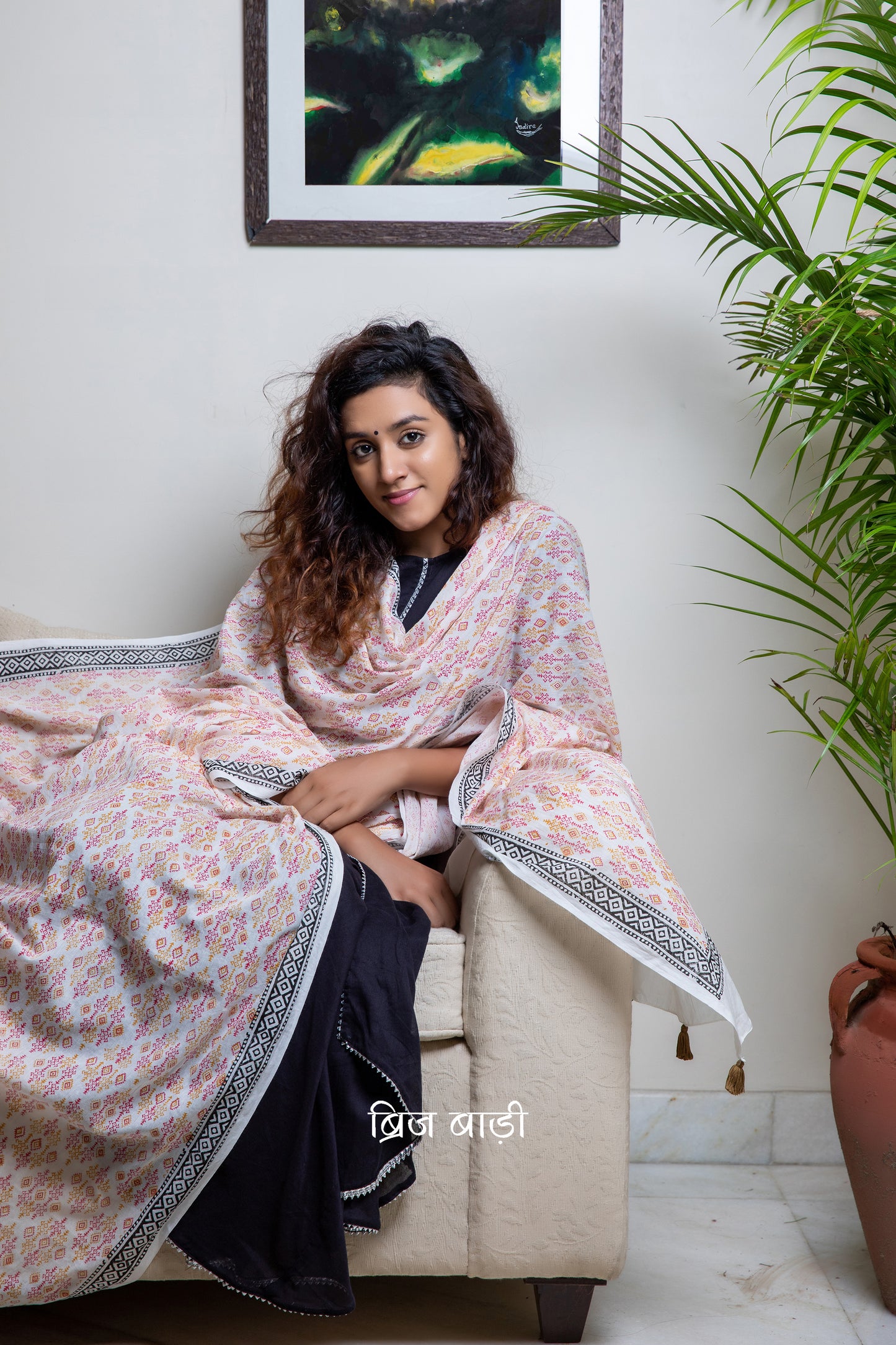 Off white soft and light-weight cotton dupatta by Brij Bari, beautifully hand block printed with a vibrant geometrical pattern in rich red and warm yellow tones. This eye-catching, artisanal design adds a lively and handcrafted touch to the elegant off-white base, making it a versatile accessory to pair with a range of suits, kurtas, or ethnic outfits. The dupatta is finished with olive green handmade thread tassels on the pallu, adding a subtle earthy contrast and a playful, artisanal finish.