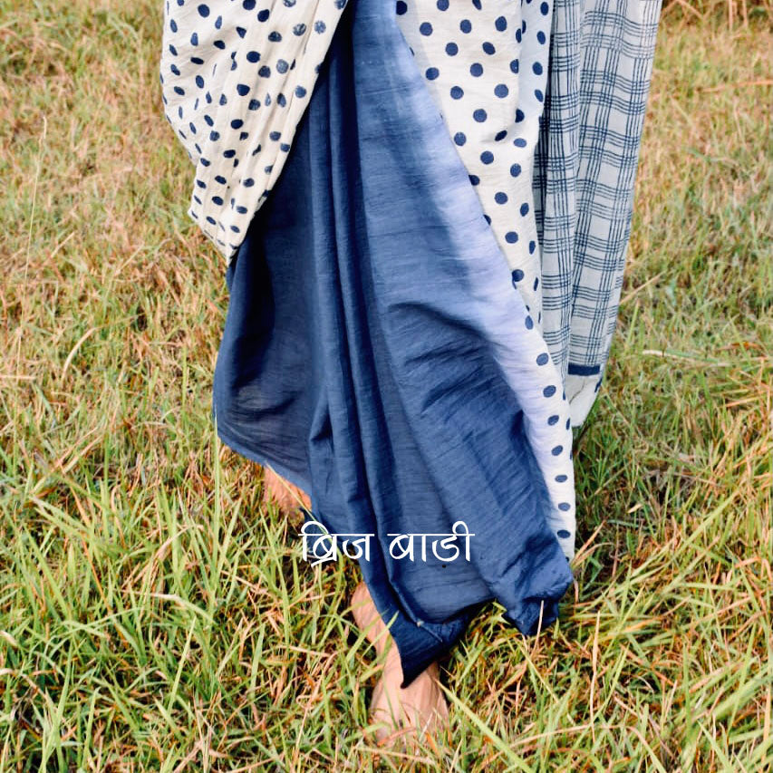 Blue Brij Bari cotton saree with hand block printed polka dots & ombre, detailed with handmade thread tassels on the pallu. Includes a free soft cotton printed blouse piece.