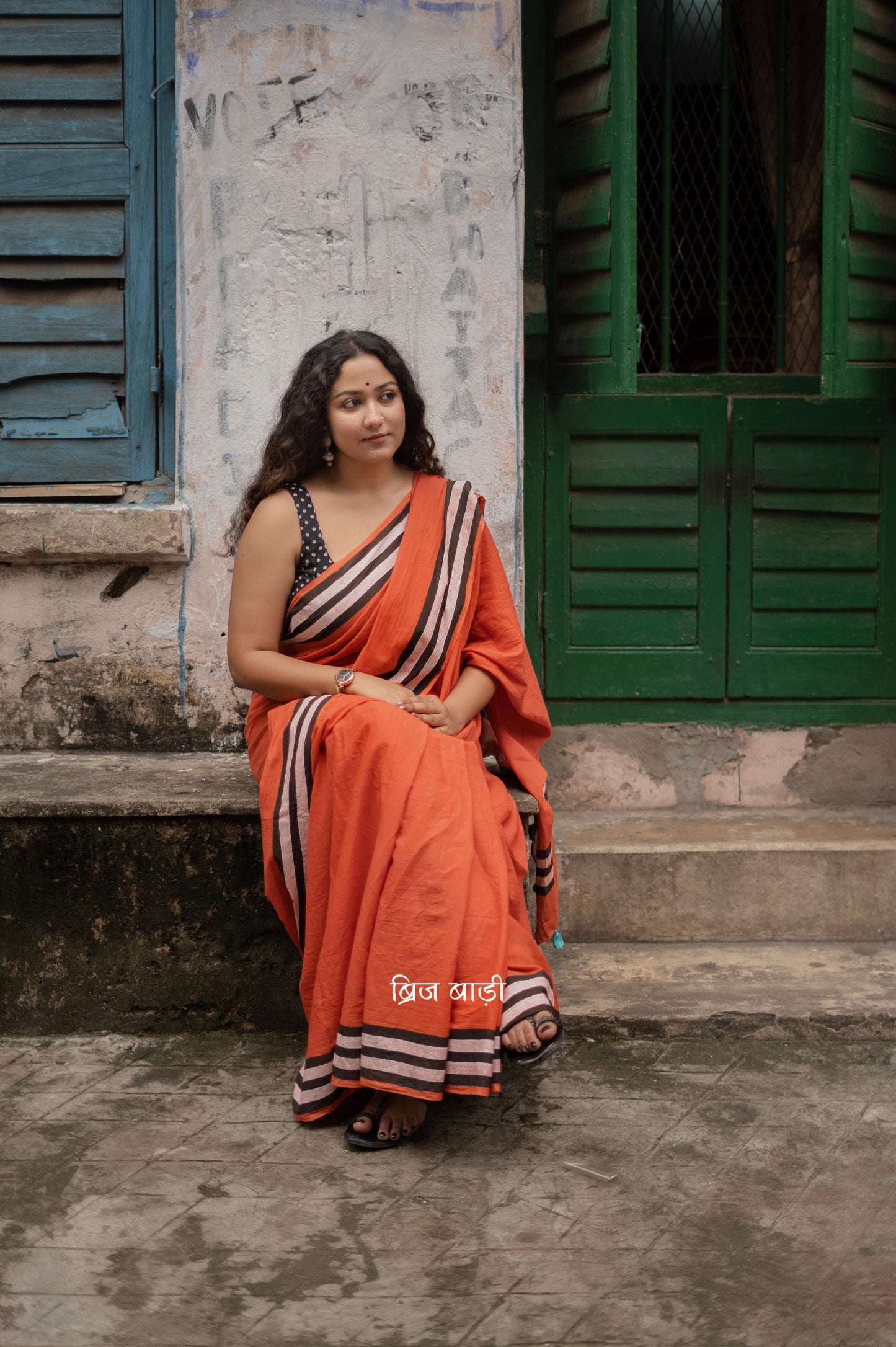 Anindita Rust Orange cotton saree with black and white stripe hand block printed border