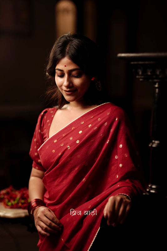 Brahmani deep red cotton saree with gold polka and crochet lace detailing and handmade thread tassel with ghungroo on palla
