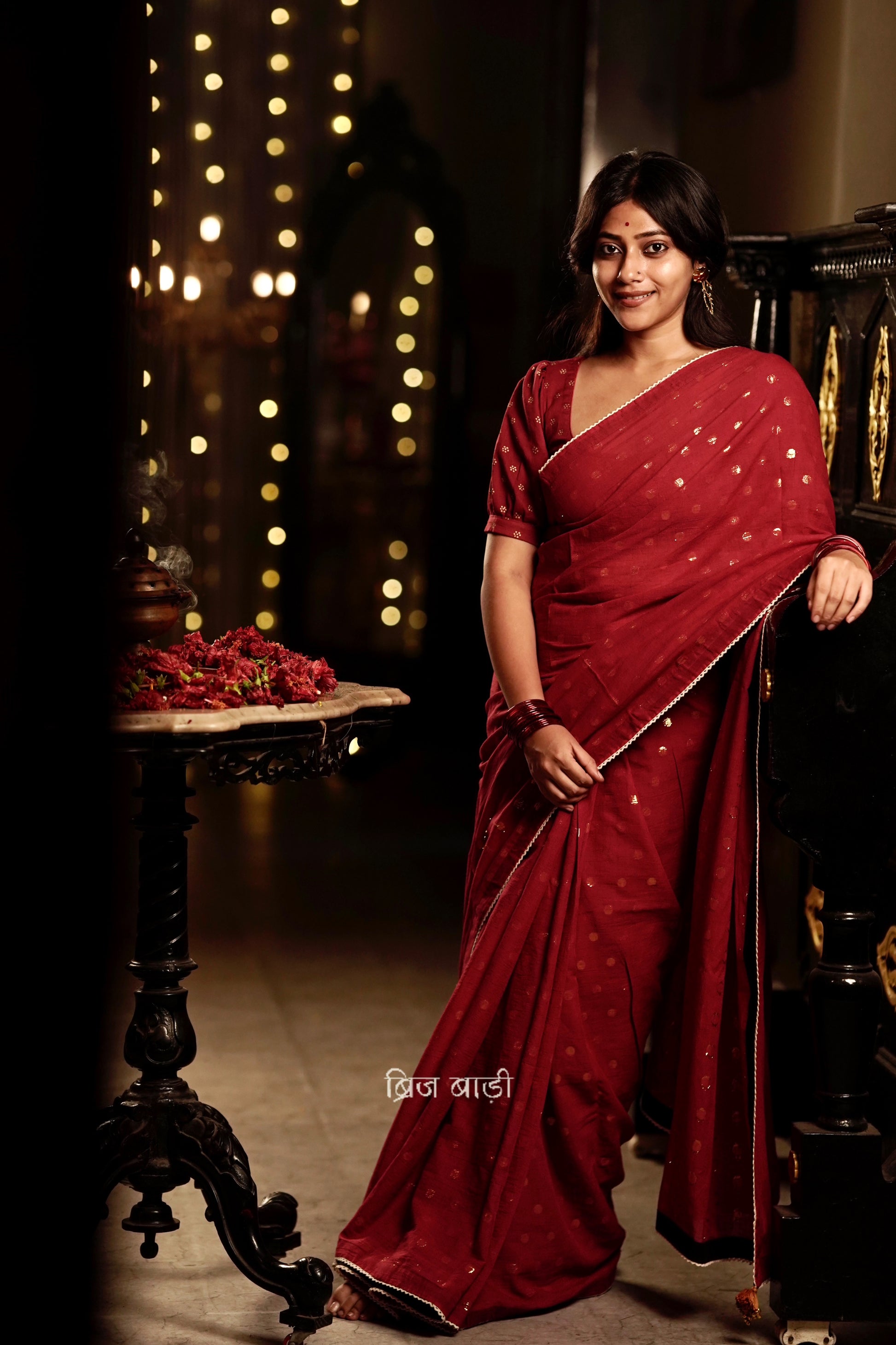 Brahmani deep red cotton saree with gold polka and crochet lace detailing and handmade thread tassel with ghungroo on palla