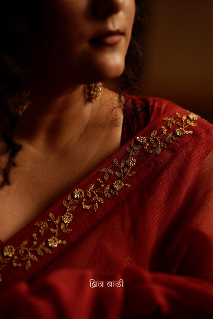 Jamuna handwoven deep-red colour Kota Doria saree with embroidered border and handmade thread tassel with ghungroo detailing on palla