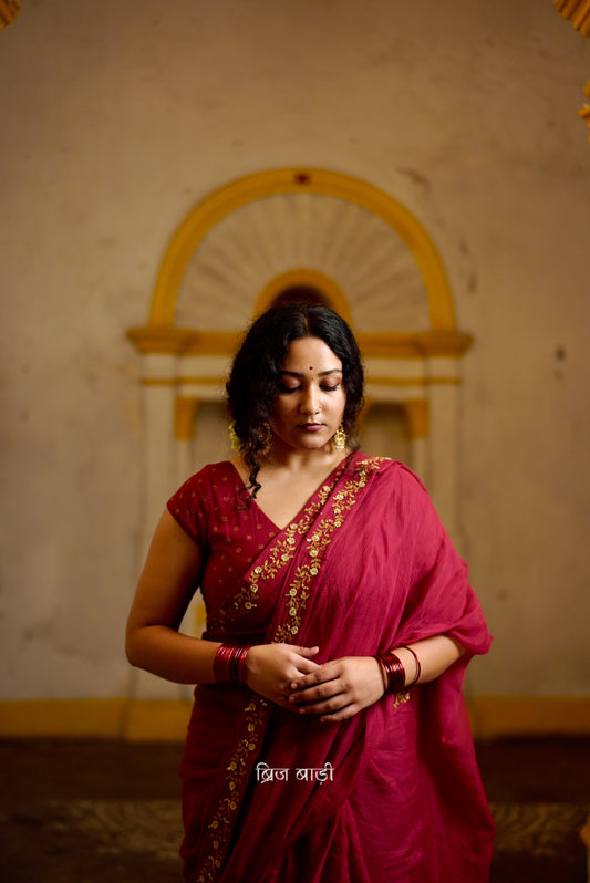 Jamuna handwoven deep-red colour Kota Doria saree with embroidered border and handmade thread tassel with ghungroo detailing on palla
