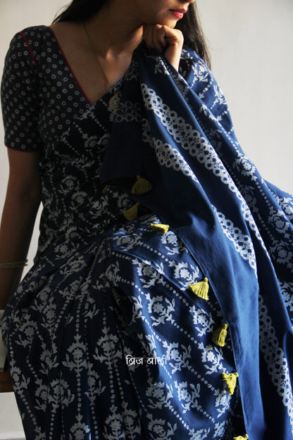 Blue hand block printed cotton saree with intricate motifs, lightweight and breathable fabric, includes a free matching blouse piece – perfect for everyday and festive wear.