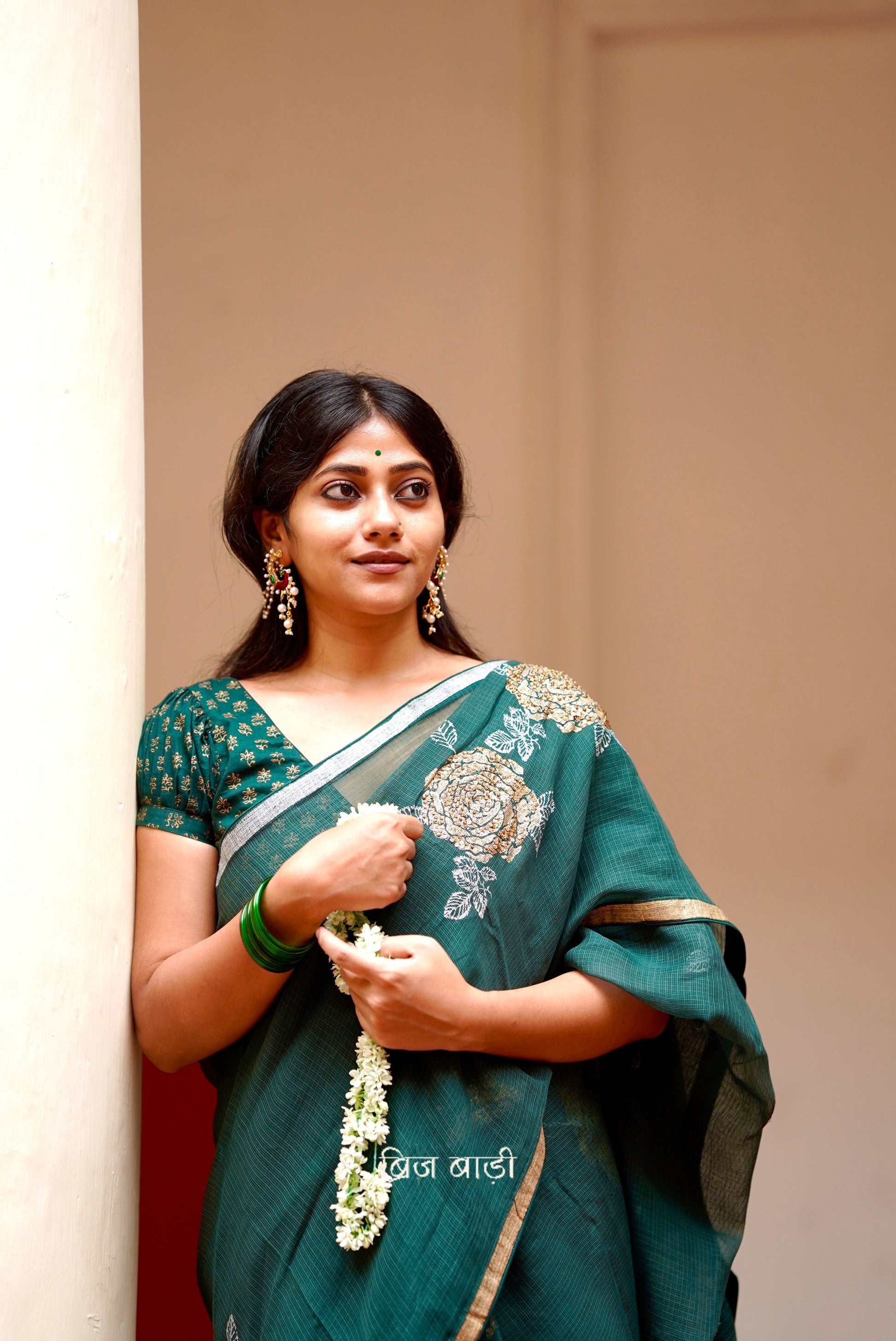 Palashini handloom handwoven Kota Doria saree with Hand block-printed floral motifs and embroidery with handmade thread tassel and ghungroo detailing on palla 