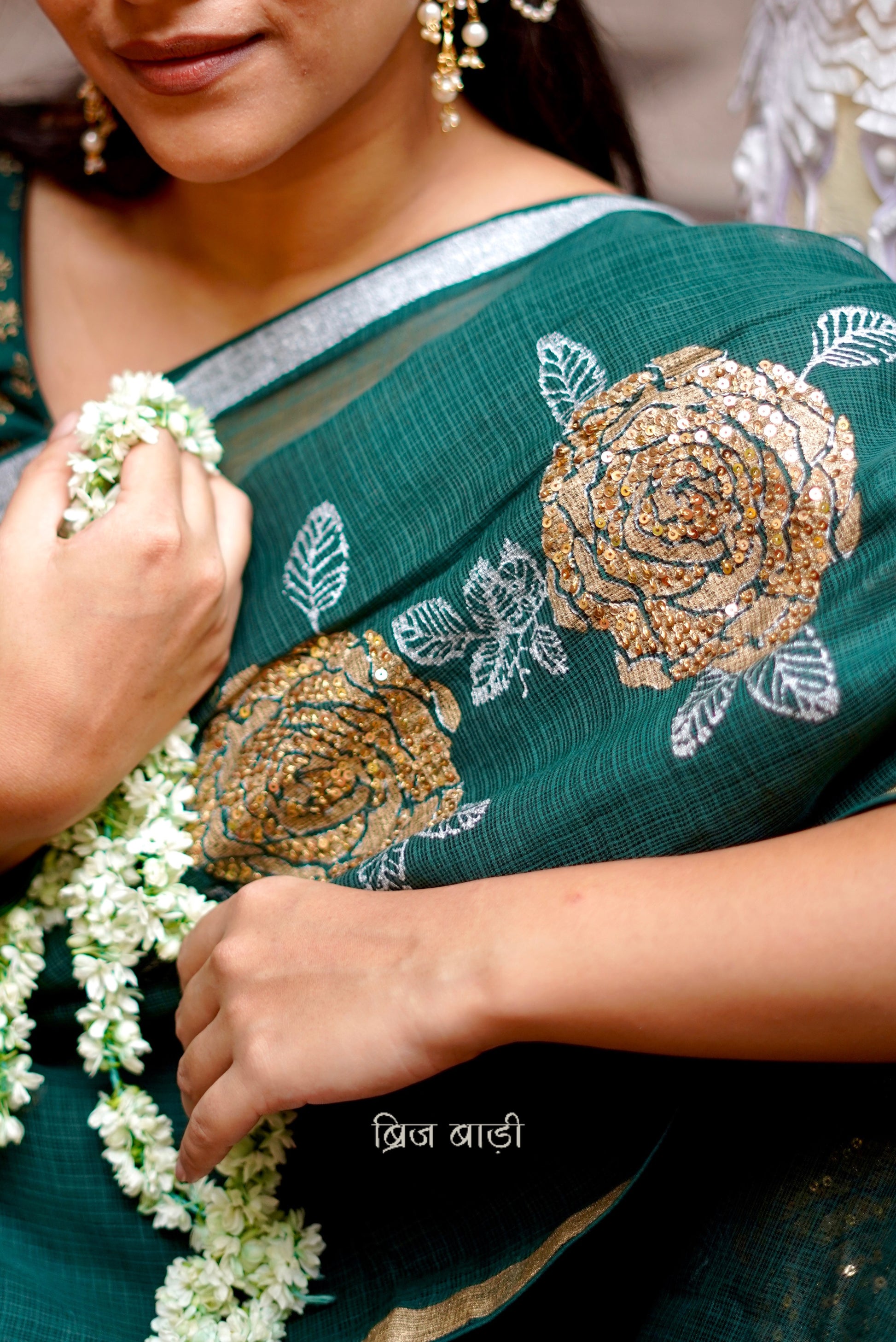 Palashini handloom handwoven Kota Doria saree with Hand block-printed floral motifs and embroidery with handmade thread tassel and ghungroo detailing on palla 