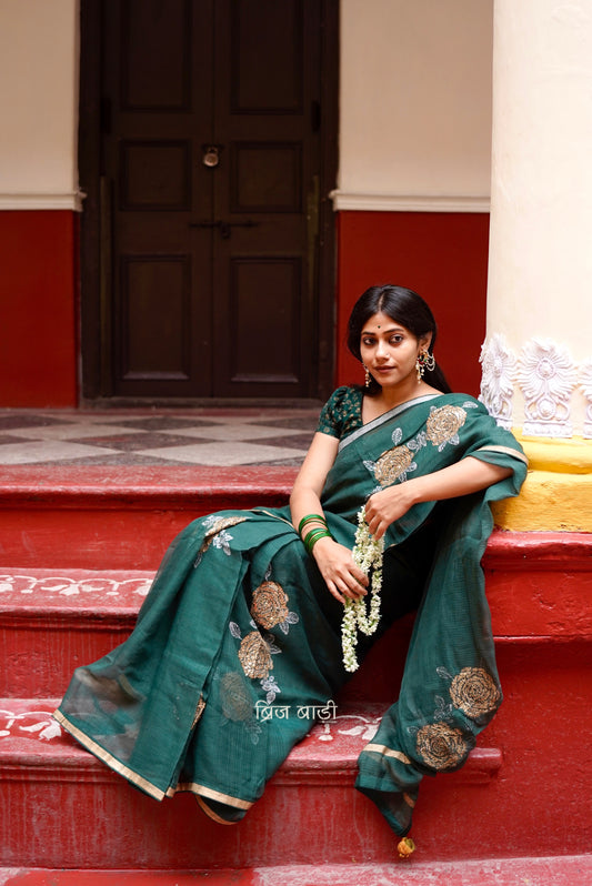 Palashini handloom handwoven Kota Doria saree with Hand block-printed floral motifs and embroidery with handmade thread tassel and ghungroo detailing on palla 