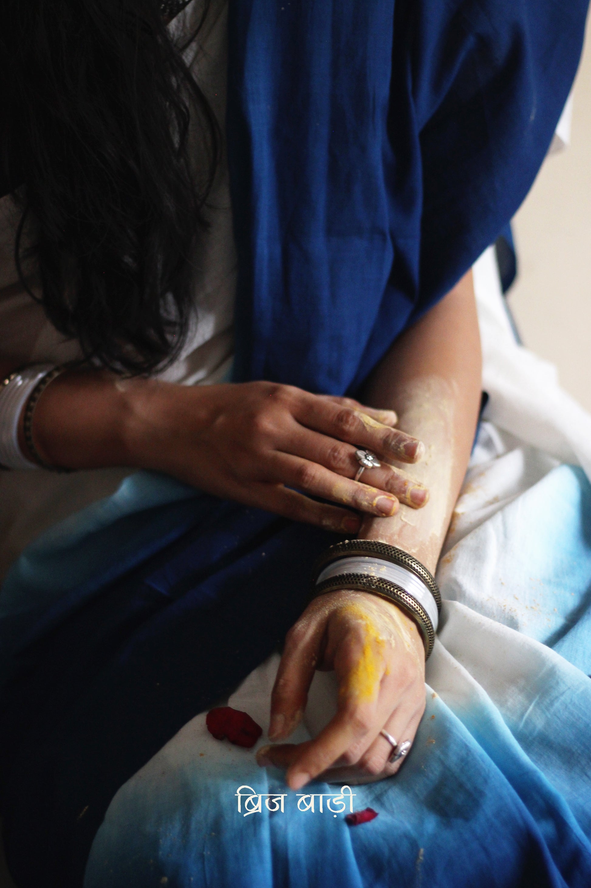 Deep Blue and off-white ombré soft cotton saree by Brij Bari, crafted for effortless elegance and all-day comfort. The subtle blend of tones adds fluidity and grace to the drape, making it perfect for both everyday wear and special occasions. The pallu is adorned with handcrafted light green thread tassels, lending a warm, artisanal touch. It comes with a free hand block printed blouse piece that complements the saree’s minimal yet striking aesthetic. Available in 8 beautiful colour options