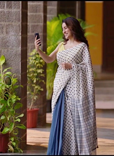 Hindi film actress Tisca Chopra wearing our Nandini cotton saree in the movie Jug Jug Jeeyo. Saree is hand block printed in blue and off-white ombre and finished with handmade light green thread tassels.