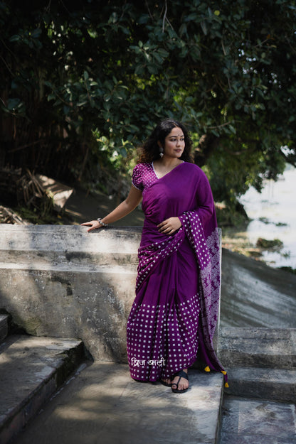 Purple soft cotton hand block printed saree with intricate patterns, offering a blend of elegance and comfort, perfect for both casual and festive occasions.