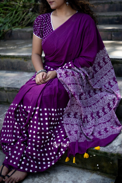 Purple soft cotton hand block printed saree with intricate patterns, offering a blend of elegance and comfort, perfect for both casual and festive occasions.