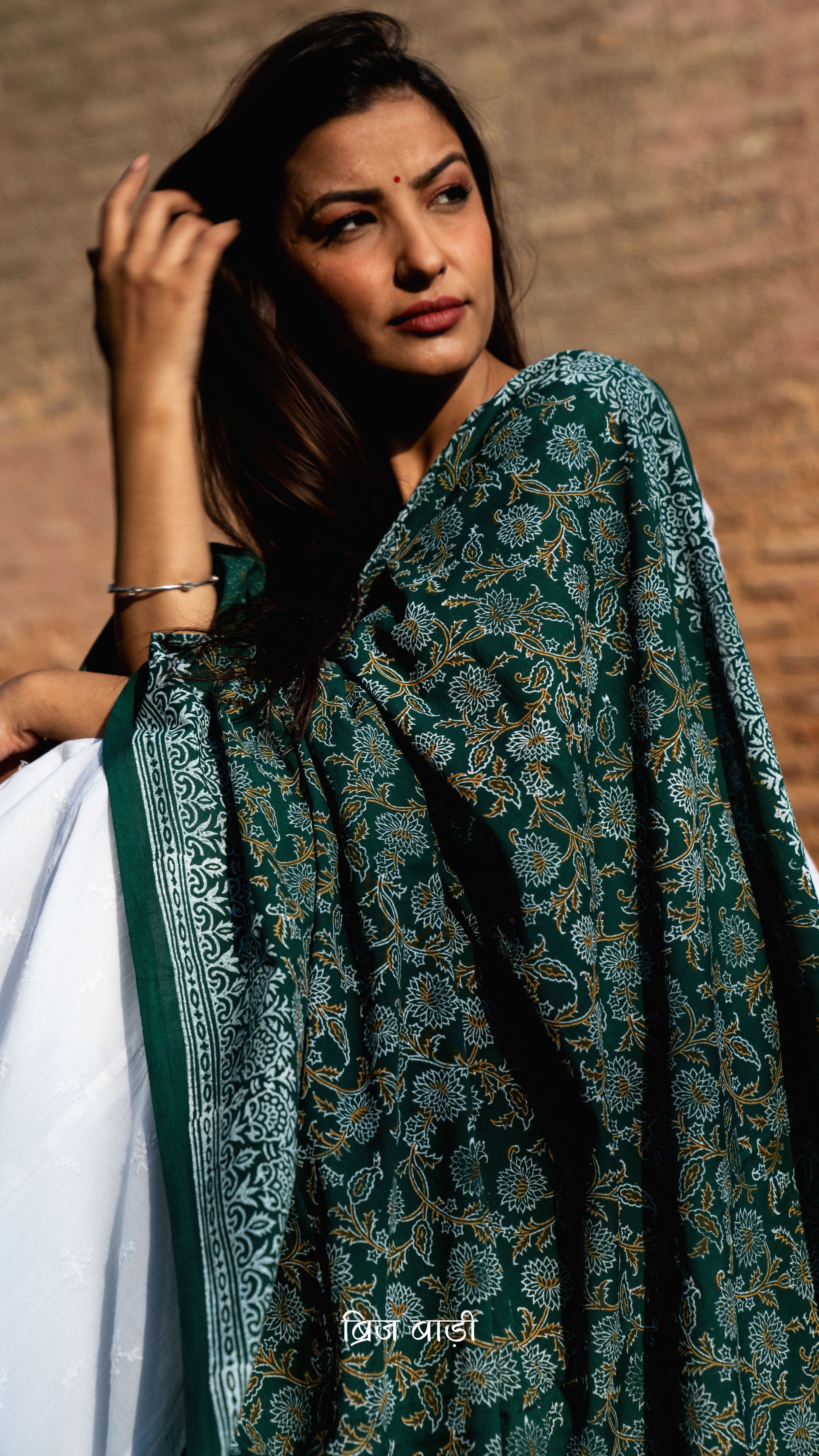 Dark green soft and lightweight cotton dupatta by Brij Bari, hand block printed with a beautiful floral pattern that brings out its artisanal charm. Finished with handcrafted mustard thread tassels on both ends of the pallu, this dupatta offers breathable comfort and a versatile look that pairs beautifully with everyday suits. Free shipping pan India.







