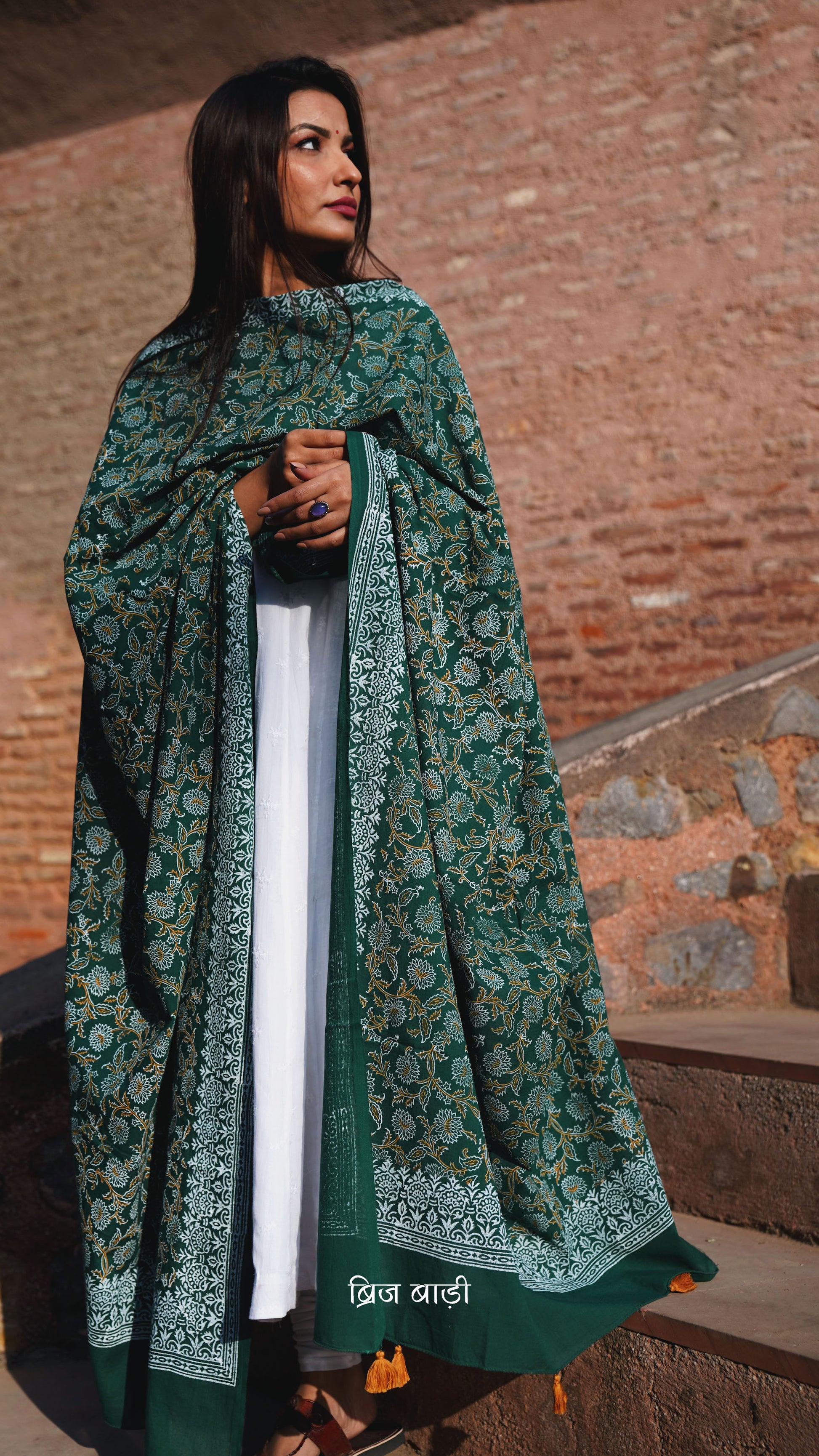 Dark green soft and lightweight cotton dupatta by Brij Bari, hand block printed with a beautiful floral pattern that brings out its artisanal charm. Finished with handcrafted mustard thread tassels on both ends of the pallu, this dupatta offers breathable comfort and a versatile look that pairs beautifully with everyday suits. Free shipping pan India.







