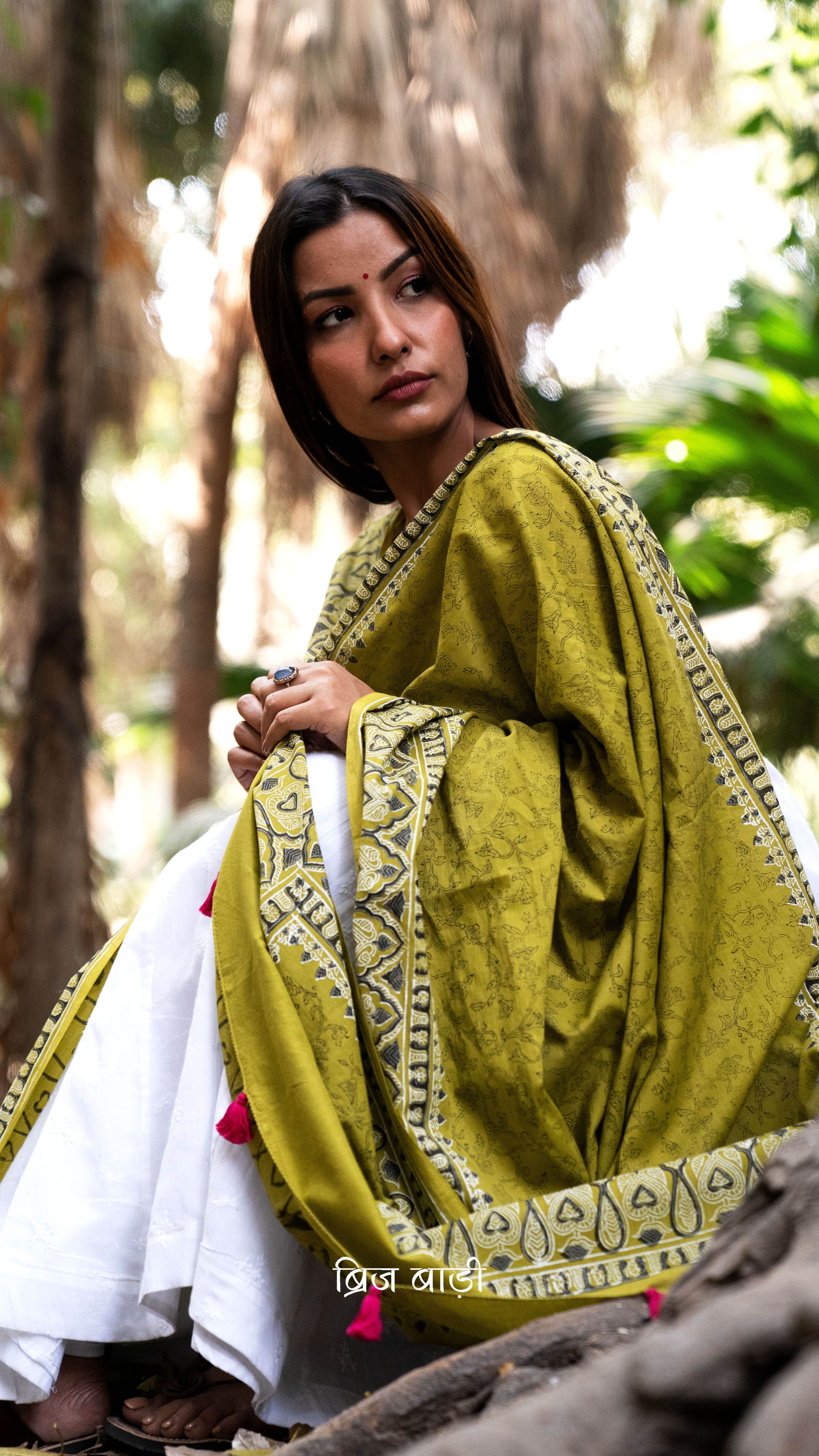 Light green soft and lightweight cotton dupatta by Brij Bari, hand block printed with delicate floral motifs, offering a beautifully handcrafted appeal. Finished with pink handmade thread tassels on both ends of the pallu, this dupatta effortlessly adds a pop of colour to your daily suits while ensuring breathable comfort and versatile style for all-day wear. Free shipping pan India.