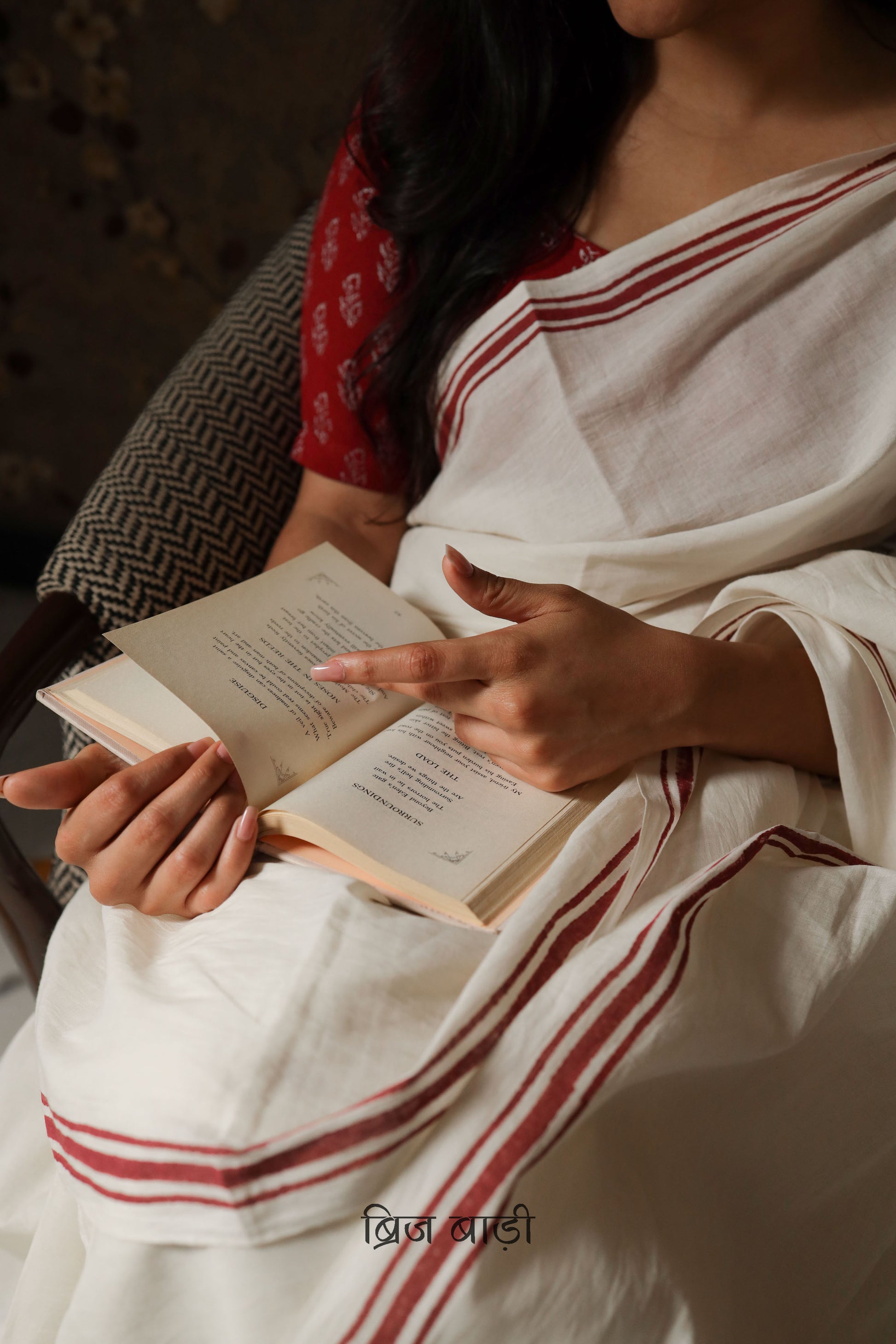 Off White soft and light-weight cotton saree by Brij Bari, crafted with a simple yet elegant deep red hand block printed stripe border. The saree is adorned with light green handmade thread tassels on the pallu, adding a vibrant touch. It comes with a free matching block printed blouse piece, offering a complete handcrafted look. Available in 2 colours, designed for all-day comfort and style, perfect for casual and everyday wear. Free shipping available pan India.