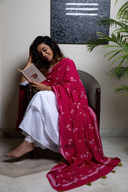 Pink soft and light-weight cotton dupatta by Brij Bari hand block printed with a delicate floral pattern creating a fresh and timeless look. Made from breathable, airy cotton fabric, this dupatta is perfect to pair with suits, kurtas, or casual ethnic outfits, adding an elegant handcrafted accent to your everyday or festive wear. The pallu is detailed with charming light green handmade thread tassels, adding a subtle pop of colour and artisanal finish. 
