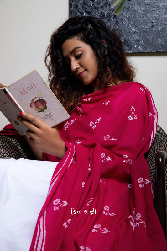 Pink soft and light-weight cotton dupatta by Brij Bari hand block printed with a delicate floral pattern creating a fresh and timeless look. Made from breathable, airy cotton fabric, this dupatta is perfect to pair with suits, kurtas, or casual ethnic outfits, adding an elegant handcrafted accent to your everyday or festive wear. The pallu is detailed with charming light green handmade thread tassels, adding a subtle pop of colour and artisanal finish. 