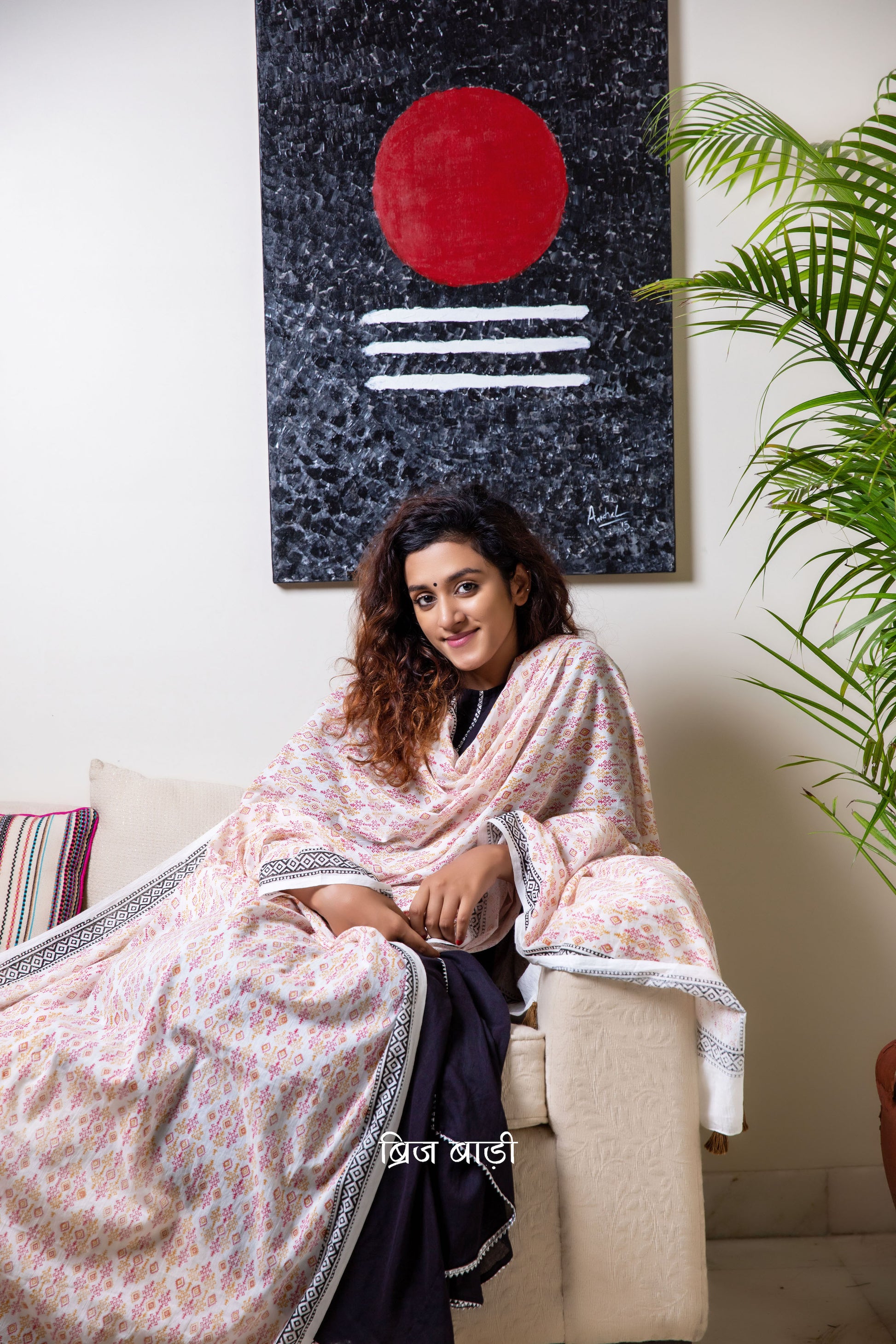 Off white soft and light-weight cotton dupatta by Brij Bari, beautifully hand block printed with a vibrant geometrical pattern in rich red and warm yellow tones. This eye-catching, artisanal design adds a lively and handcrafted touch to the elegant off-white base, making it a versatile accessory to pair with a range of suits, kurtas, or ethnic outfits. The dupatta is finished with olive green handmade thread tassels on the pallu, adding a subtle earthy contrast and a playful, artisanal finish. 